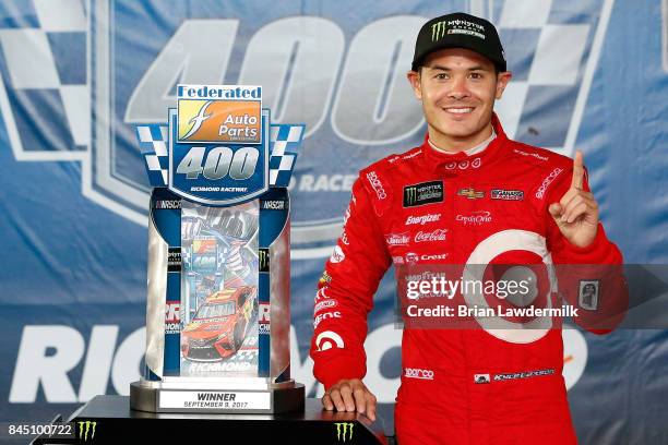 Kyle Larson, driver of the Target Chevrolet, poses with the trophy in Victory Lane after the Monster Energy NASCAR Cup Series Federated Auto Parts...