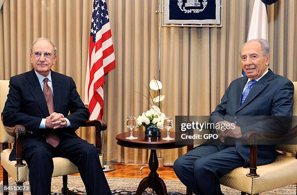 In this handout image provided by the GPO , U.S. Special Envoy to the Middle East George J. Mitchell attends a meeting with Israeli President Shimon...