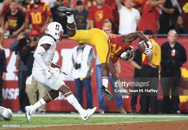 Ronald Jones II of the USC Trojans flips into the end zone to score a fourth quarter touchdown against the Stanford Cardinal at Los Angeles Memorial...