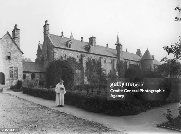 Monk outside the monastery of Mount St Bernard, Leicestershire, circa 1930.