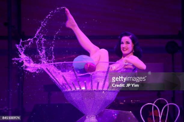 Dita Von Teese performs at the runway at the Philipp Plein fashion show during New York Fashion Week: The Shows at Hammerstein Ballroom on September...