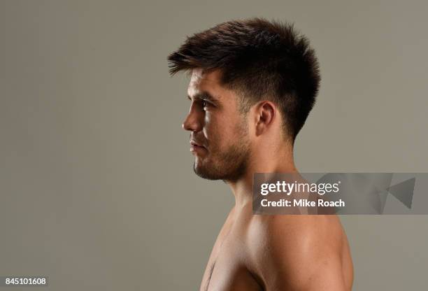 Henry Cejudo poses for a post fight portrait backstage during the UFC 215 event inside the Rogers Place on September 9, 2017 in Edmonton, Alberta,...
