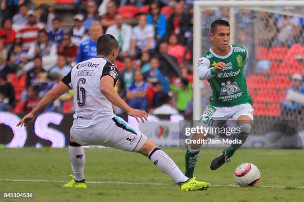 Jose Rodriguez of Leon fights for the ball with Javier Güemez of Queretaro during the 8th round match between Queretaro and Leon as part of the...