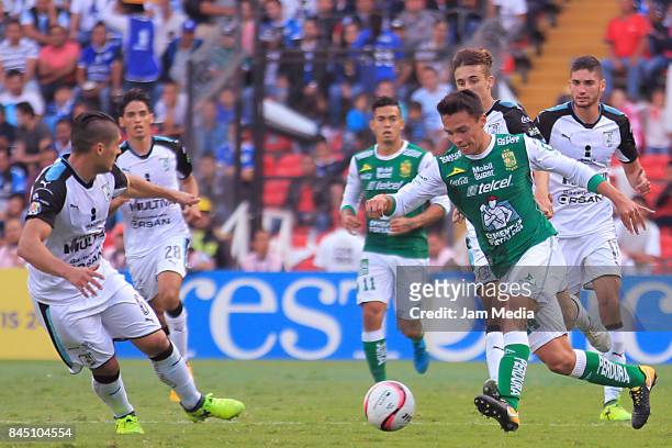 Javier Guemez of Queretaro and Osvaldo Rodriguez of Leon fight for the ball during the 8th round match between Queretaro and Leon as part of the...