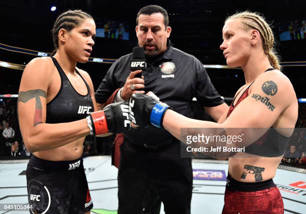 Amanda Nunes of Brazil and Valentina Shevchenko of Kyrgyzstan touch gloves in their women's bantamweight bout during the UFC 215 event inside the...
