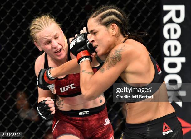 Valentina Shevchenko of Kyrgyzstan punches Amanda Nunes of Brazil in their women's bantamweight bout during the UFC 215 event inside the Rogers Place...