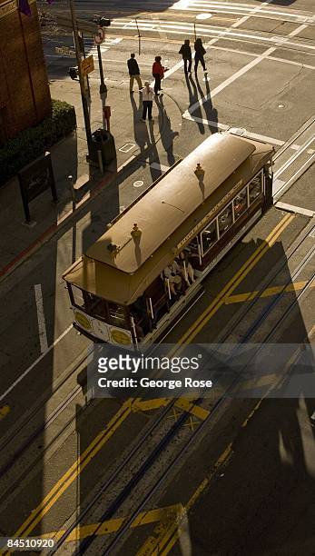 Cable car on Powell Street is bathed in early morning light in this 2009 San Francisco, California, city landscape photo taken from a balcony at the...