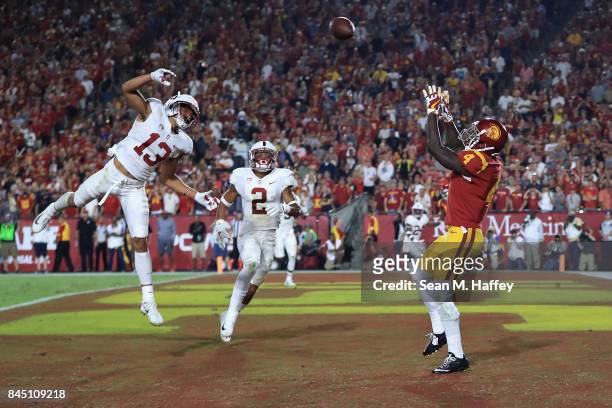 Steven Mitchell Jr. #4 of the USC Trojans makes a reception to score a fourth quarter touchdown against the Stanford Cardinal at Los Angeles Memorial...