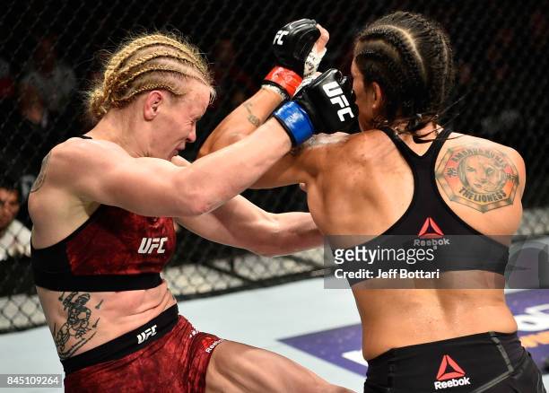 Amanda Nunes of Brazil elbows Valentina Shevchenko of Kyrgyzstan in their women's bantamweight bout during the UFC 215 event inside the Rogers Place...