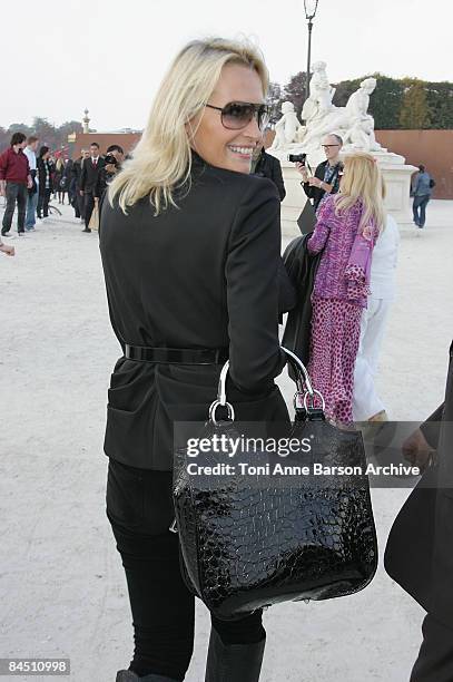 Estelle Lefebure attends the Christian Dior '09 Spring Summer Ready-to-Wear fashion show at the Jardin des Tuileries on September 29, 2008 in Paris,...