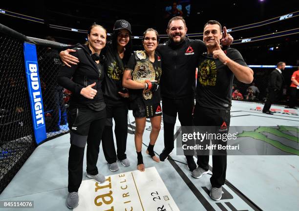 Amanda Nunes of Brazil celebrates her victory over Valentina Shevchenko of Kyrgyzstan in their women's bantamweight bout during the UFC 215 event...