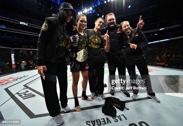 Amanda Nunes of Brazil celebrates her victory over Valentina Shevchenko of Kyrgyzstan in their women's bantamweight bout during the UFC 215 event...