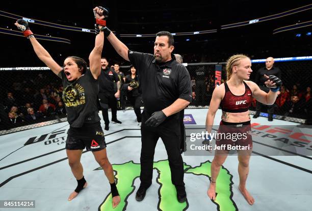 Amanda Nunes of Brazil celebrates her victory over Valentina Shevchenko of Kyrgyzstan in their women's bantamweight bout during the UFC 215 event...