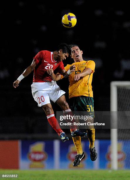 Bambang Pamungkas of Indonesia challenges Rodrigo Vargas of Australia during the AFC Asian Cup 2011 Qualification match between Indonesia and...