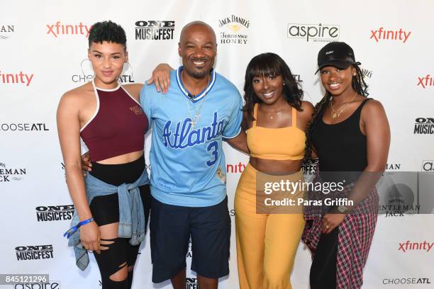 Gabrielle Carreiro, Big Tigger, Ashly Williams, and Shyann Roberts of June's Diary pose Big Tigger at 2017 ONE Music Fest at Lakewood Amphitheatre on...