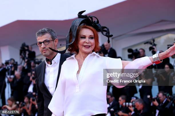 Marina Ripa di Meana and a guest arrive at the Award Ceremony during the 74th Venice Film Festival at Sala Grande on September 9, 2017 in Venice,...