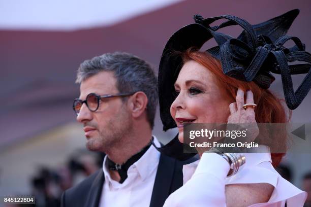 Marina Ripa di Meana and a guest arrive at the Award Ceremony during the 74th Venice Film Festival at Sala Grande on September 9, 2017 in Venice,...