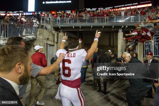 Oklahoma Sooners quarterback Baker Mayfield celebrates as he leaves the field at the conclusion of the game between the Oklahoma Sooners and the Ohio...