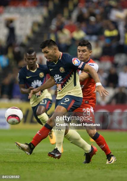 Silvio Romero of America fights for the ball with Jesus Peganoni of Veracruz during the 8th round match between America and Veracruz as part of the...