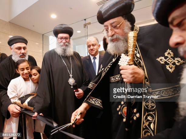 Coptic Pope Tawadros II cuts the ribbon at the opening of the new Coptic church inside Eporo Tower on September 10, 2017 in Melbourne, Australia....