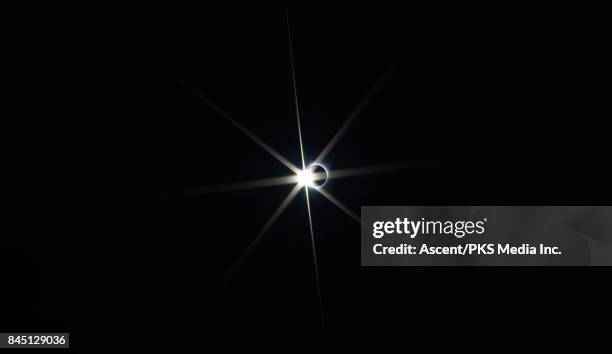 solar eclipse against dark sky - solar eclipse in canada stock pictures, royalty-free photos & images