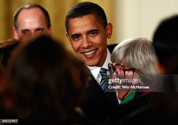 President Barack Obama greets business leaders and guests after speaking on the U.S. Economy from the East Room of the White House January 28, 2009...