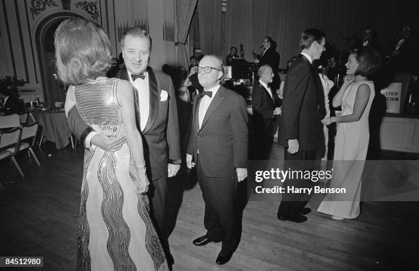 American writer Truman Capote at his Black-and-White Ball in the Grand Ballroom of the Plaza Hotel, New York City, 28th November 1966. At the far...