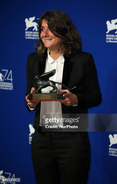 Producer Valentina Novati poses with the Special Orizzonti Jury Prize Award for 'Caniba' on behalf of Verena Paravel at the Award Winners photocall...