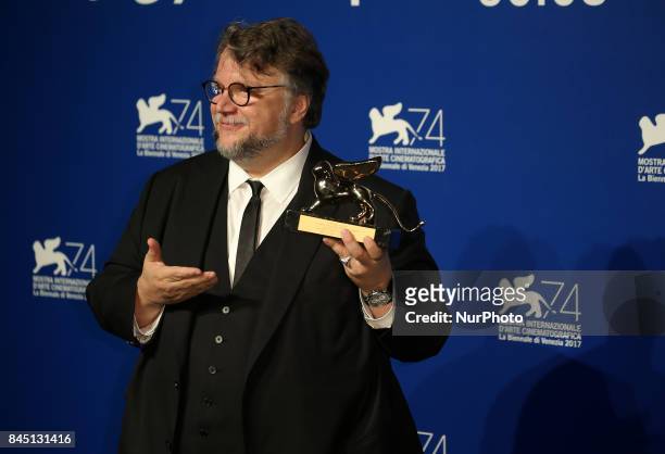 Guillermo del Toro poses with the Golden Lion for Best Film Award for 'The Shape Of Water' at the Award Winners photocall during the 74th Venice Film...