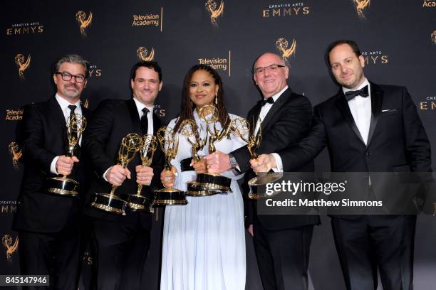 Angus Wall, Spencer Averick, Ava Duvernay, Howard Barish, and Jason Sterman pose in the pressroom during the 2017 Creative Arts Emmy Awards at...