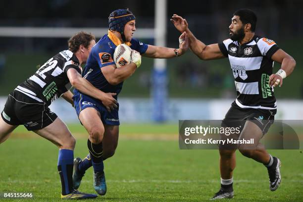 Teihorangi Walden of Otago fends Cardiff Vaega of Hawke's Bay during the round four Mitre 10 Cup match between Hawke's Bay and Otago at McLean Park...