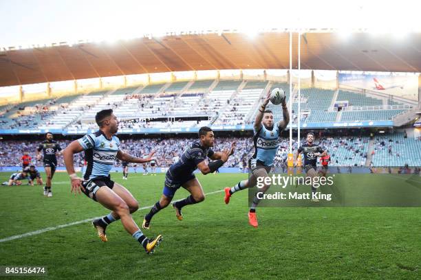Jack Bird of the Sharks grabs the ball to score a try during the NRL Elimination Final match between the Cronulla Sharks and the North Queensland...