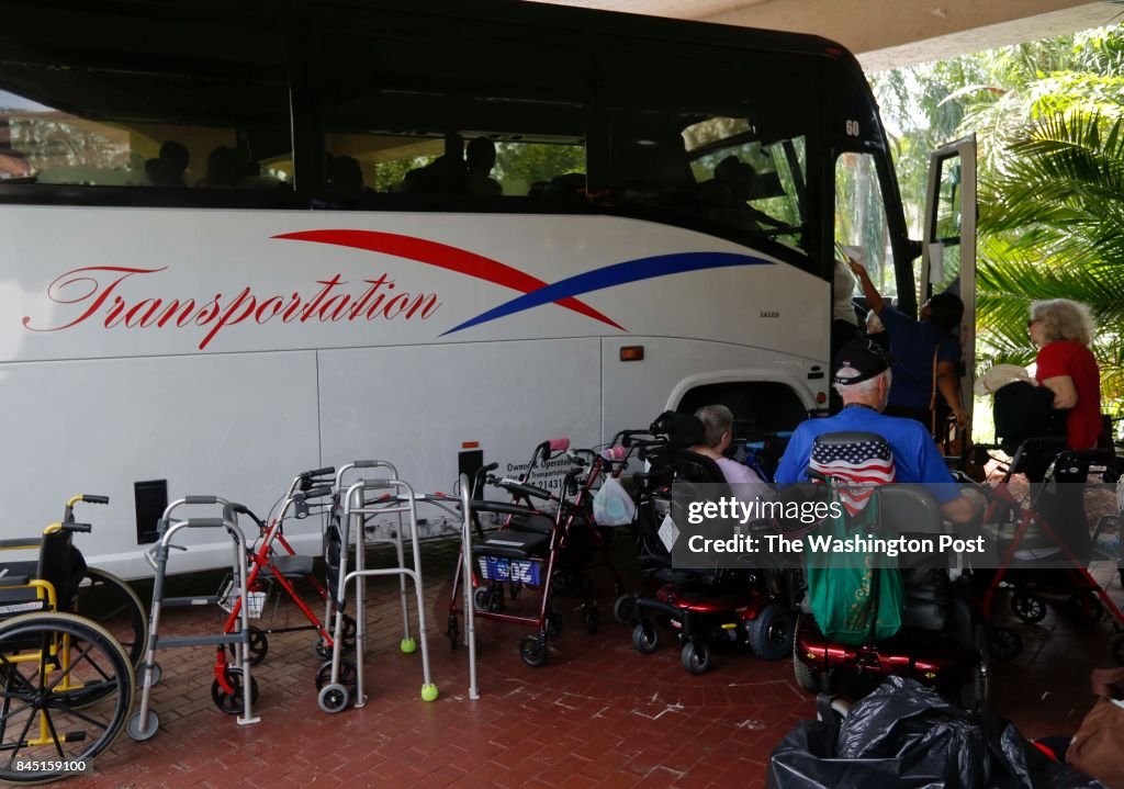 MIAMI, FL- SEPTEMBER 8: One of the buses is loaded at Brookdale, Margate, a retirement community west of Ft Lauderdale, FL
