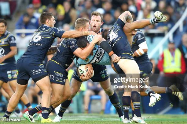 Andrew Fifita of the Sharks is tackled during the NRL Elimination Final match between the Cronulla Sharks and the North Queensland Cowboys at Allianz...