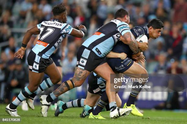 Jason Taumalolo of the Cowboys is tackled during the NRL Elimination Final match between the Cronulla Sharks and the North Queensland Cowboys at...