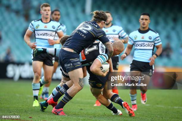 Luke Lewis of the Sharks is tackled during the NRL Elimination Final match between the Cronulla Sharks and the North Queensland Cowboys at Allianz...