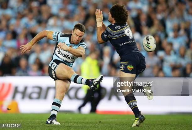 Jake Granville of the Cowboys blocks the field goal attempt James Maloney of the Sharks during reguar time during the NRL Elimination Final match...