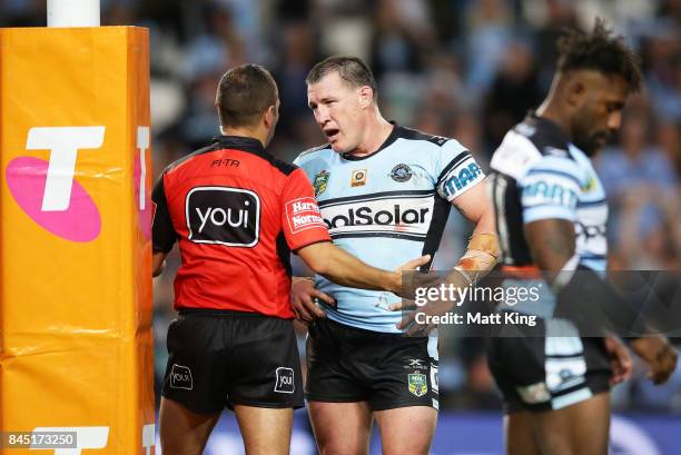 Paul Gallen of the Sharks argues with referee Ashley Klein after he awarded a penalty at the end of extra time during the NRL Elimination Final match...