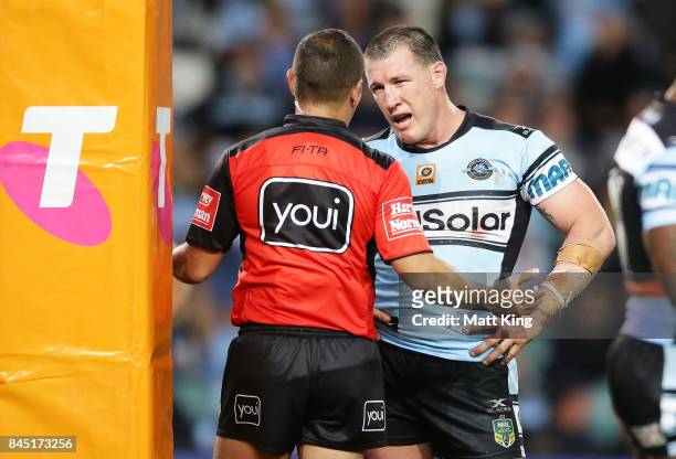 Paul Gallen of the Sharks argues with referee Ashley Klein after he awarded a penalty at the end of extra time during the NRL Elimination Final match...