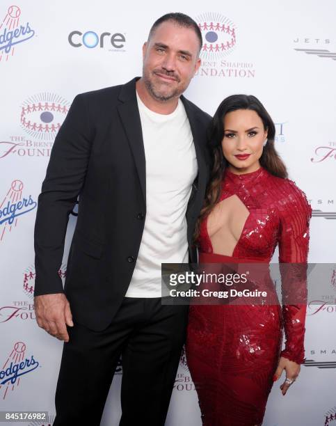 Demi Lovato and Mike Bayer arrive at the annual Brent Shapiro Foundation For Alcohol and Drug Prevention Summer Spectacular at a Private Residence on...
