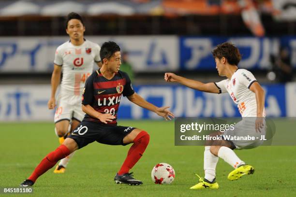 Hiroki Abe of Kashima Antlers takes on Keisuke Oyama of Omiya Ardija during the J.League J1 match between Kashima Antlers and Omiya Ardija at Kashima...