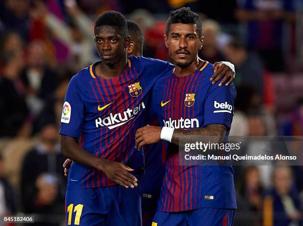 Ousmane Dembele and Paulinho of Barcelona celebrate after the La Liga match between Barcelona and Espanyol at Camp Nou on September 9, 2017 in...