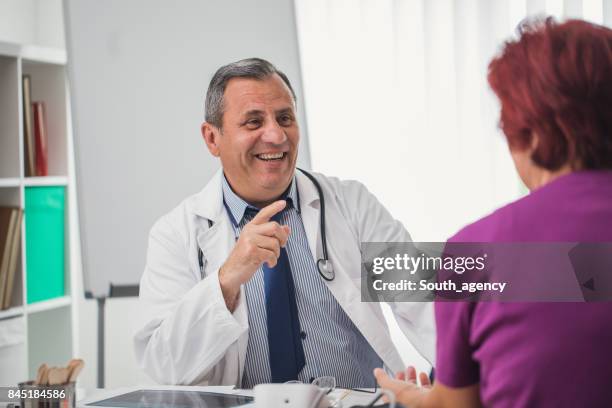 doctor talking to pacient - ordination stock pictures, royalty-free photos & images