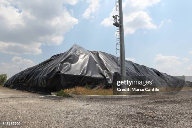 Black plastic canvas covers the garbage bales of San Tammaro, a waste dump in the province of Caserta.