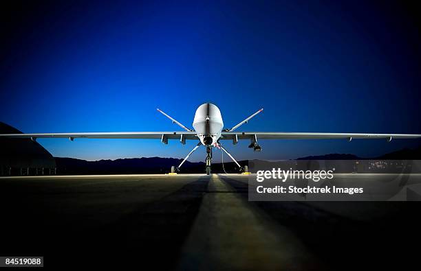 an mq-9 reaper sits on the flightline. - military drone stock pictures, royalty-free photos & images