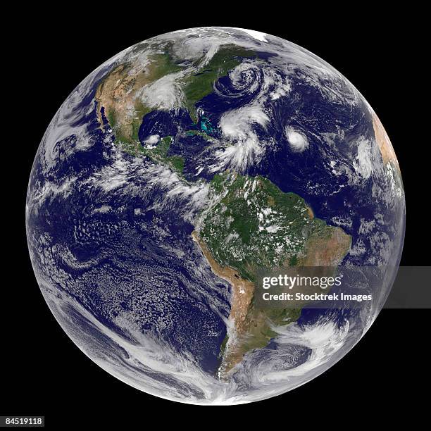 full earth showing four storm systems. - tropical storm stock pictures, royalty-free photos & images