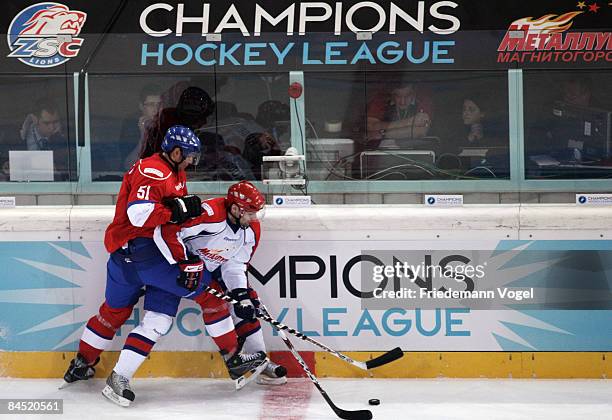 Jaroslav Kudrna of Magnitogorsk in action with Ryan Gardner of Zurich during the IIHF Champions League final between ZSC Lions Zurich and Metallurg...