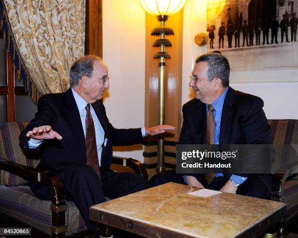 In this handout image from U.S. Embassy Tel Aviv, Special Envoy George Mitchell speaks with Israeli Minister of Defence Ehud Barak during a meeting...