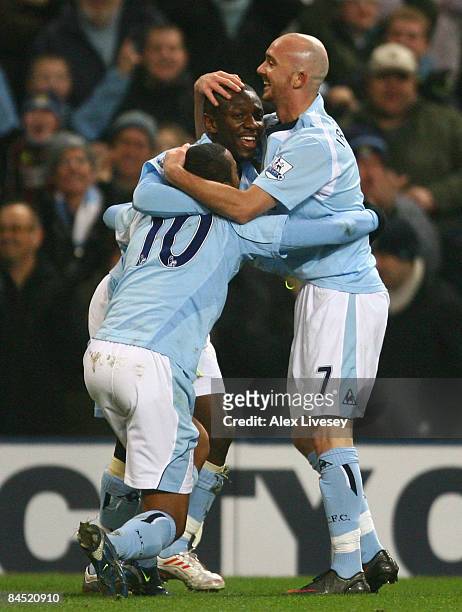 Shaun Wright-Phillips of Manchester City celebrates scoring the opening goal with team mates Stephen Ireland and Robinho during the Barclays Premier...