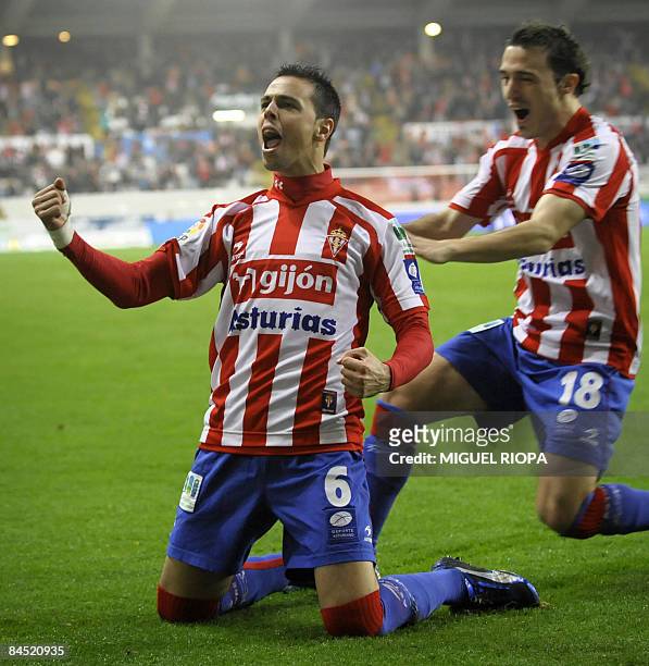 Sporting Gijon's Carmelo Gonzalez celebrates after scoring against Athletic Bilbao with teammate Luis Moran during their Spanish King´s Cup quarter...